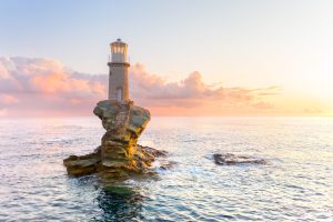 The beautiful Lighthouse Tourlitis of Chora, Andros at night.