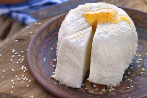 Kalathaki cheese served with sesame and honey as a dessert.