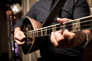 Greek guitar player on a party. Music band, Wedding band.